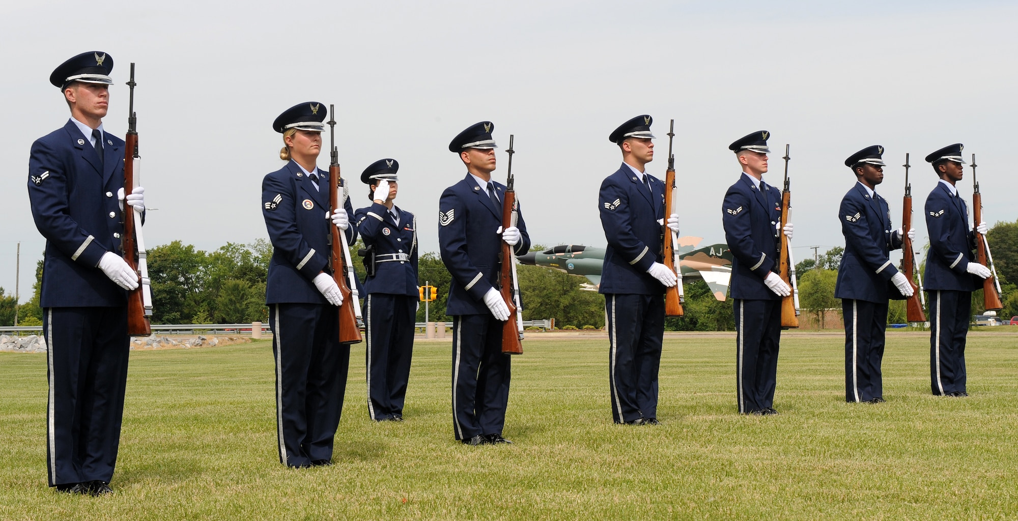 LANGLEY AIR FORCE BASE, Va. --  Members of the Langley Honor Guard pay their respect by presenting arms in a demonstration of a funeral ceremony during their graduation ceremony here July 9.  This was the first flight from Langley to be trained by the Air Force Honor Guard Training Team.  (U.S. photo/Senior Airman Zachary Wolf)

