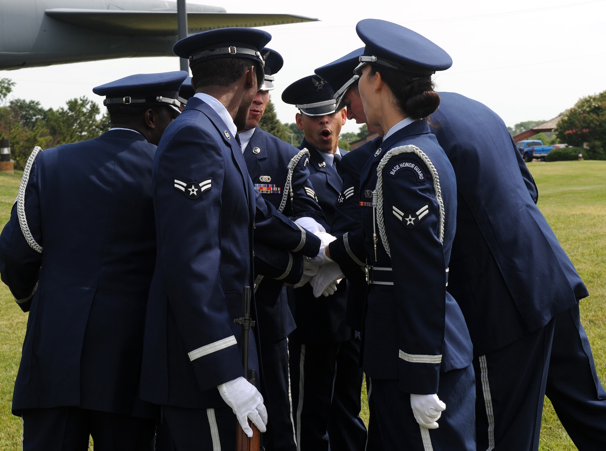 LANGLEY AIR FORCE BASE, Va. --  Members of the Langley Honor Guard huddle before their graduation ceremony here July 9.  This was the first flight from Langley to be trained by the Air Force Honor Guard Mobile Training Team.  (U.S. photo/Senior Airman Zachary Wolf)