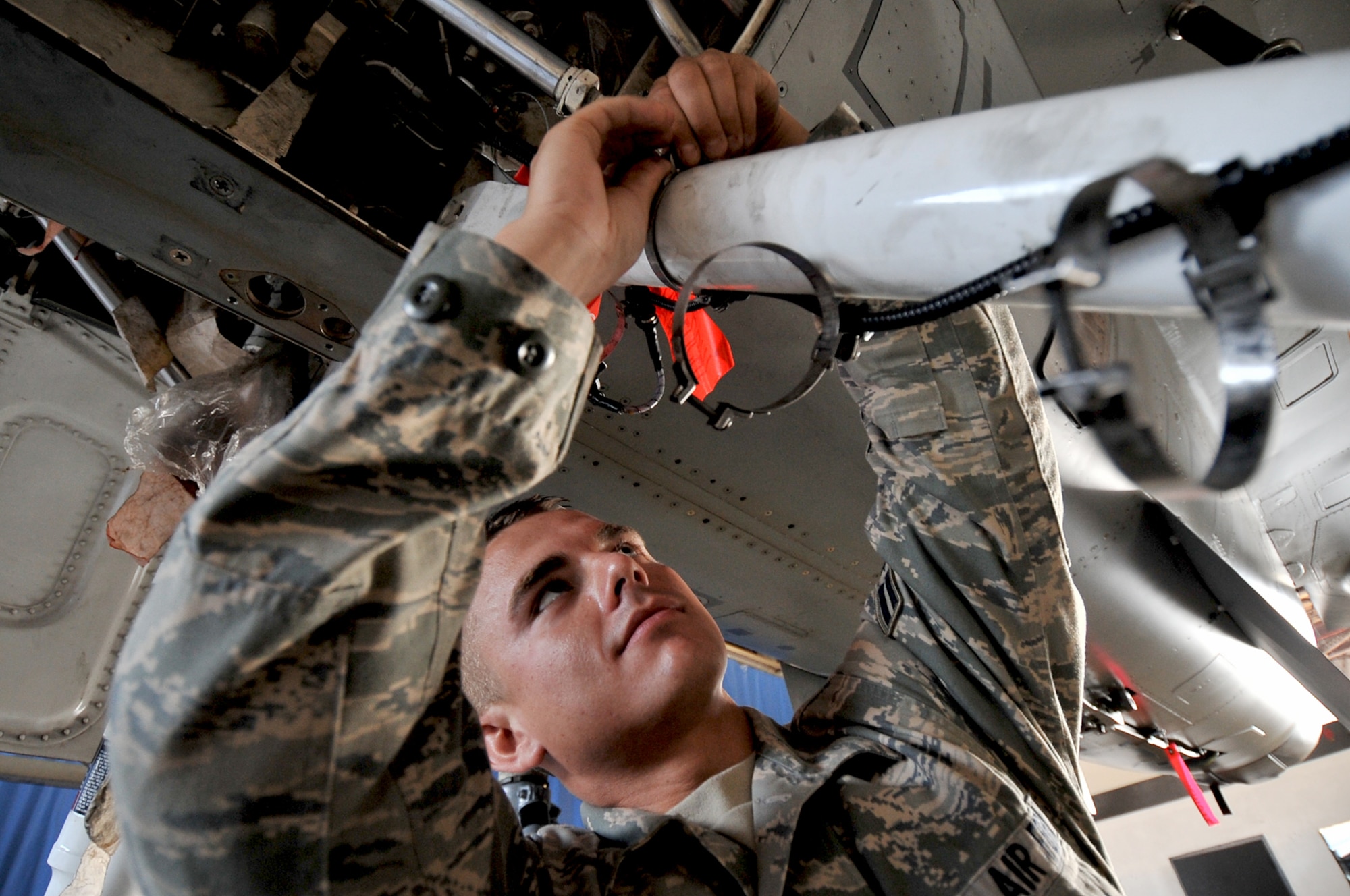 SHAW AFB, S.C. -- 20th Aircraft Maintenance Squadron member Airman 1st Class Eric Rigsby, inspects the harness of an F-16CJ aircraft braking system, July 10. The 20th Maintenance Group is performing preventive maintenance inspections on all aircraft due to an unusual number of anti-skid problems. (U.S. Air Force photo/Senior Airman Kathrine McDowell)
