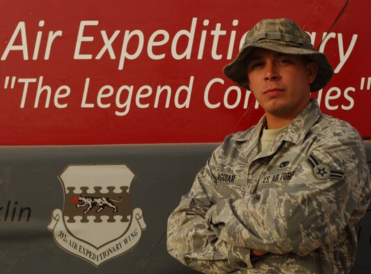 JOINT BASE BALAD, Iraq—Airman 1st Class Jefferson Aguiar of the 727th Expeditionary Air Control Squadron stands in front of the 332nd Air Expeditionary Wing headquarters building here July 10. Airman Aguiar is the 332nd AEW Tuskegee Airman of the Week for June 28-July 4. A St. Petersburg Fla., native, he is deployed here from Eglin Air Force Base, Fla. (U.S. Air Force photo/Senior Airman Andria J. Allmond) 
