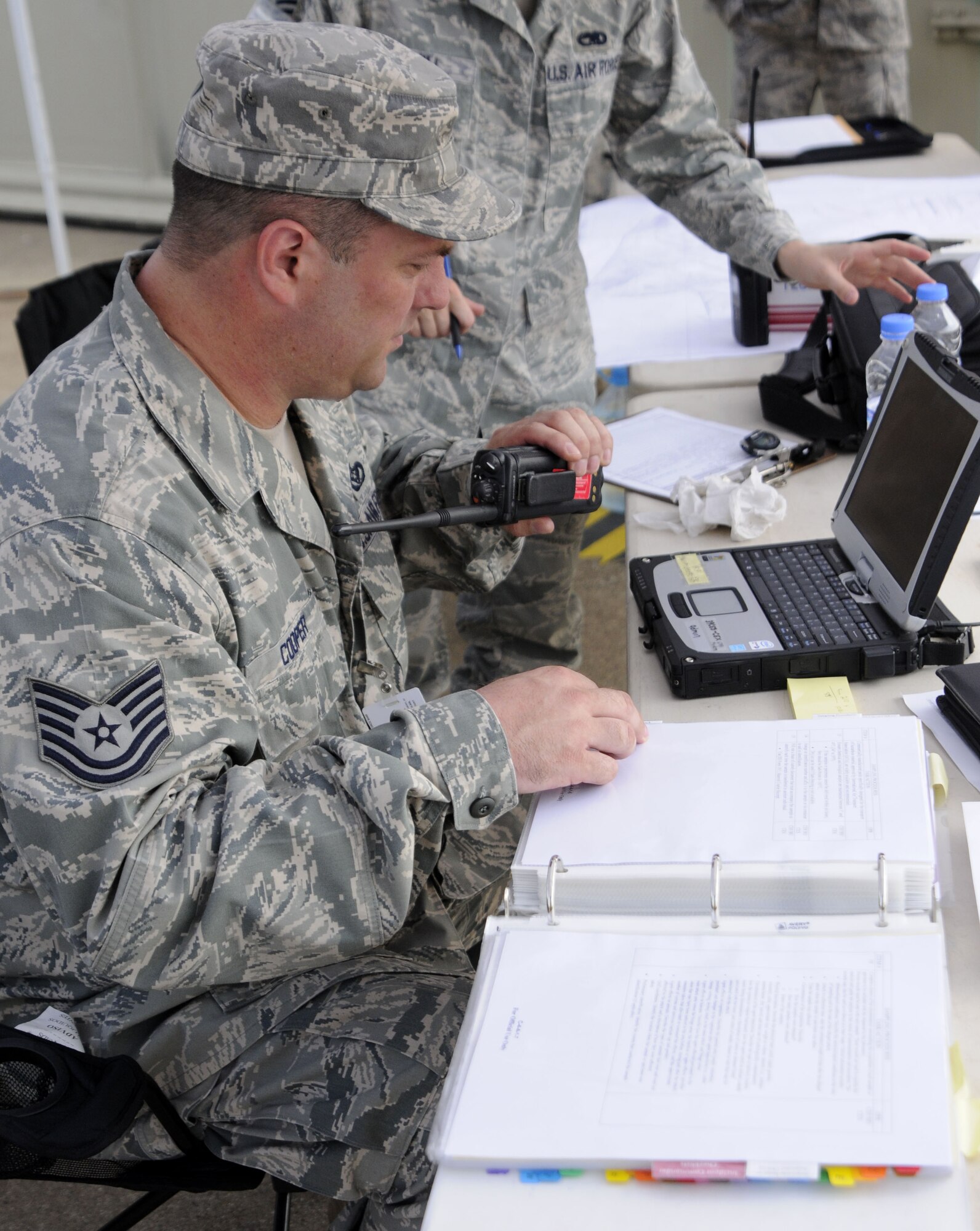 Tech. Sgt. Scott Cooper, 39th Civil Engineer Squadron, uses plotting software to track suspected simulated airborne hazards of the incident Wednesday, July 8, 2009, during an exercise at Incirlik Air Base, Turkey. An exercise evaluation team evaluated participating squadrons on their exercise responses. (U.S. Air Force photo/Airman 1st Class Amber Russell)