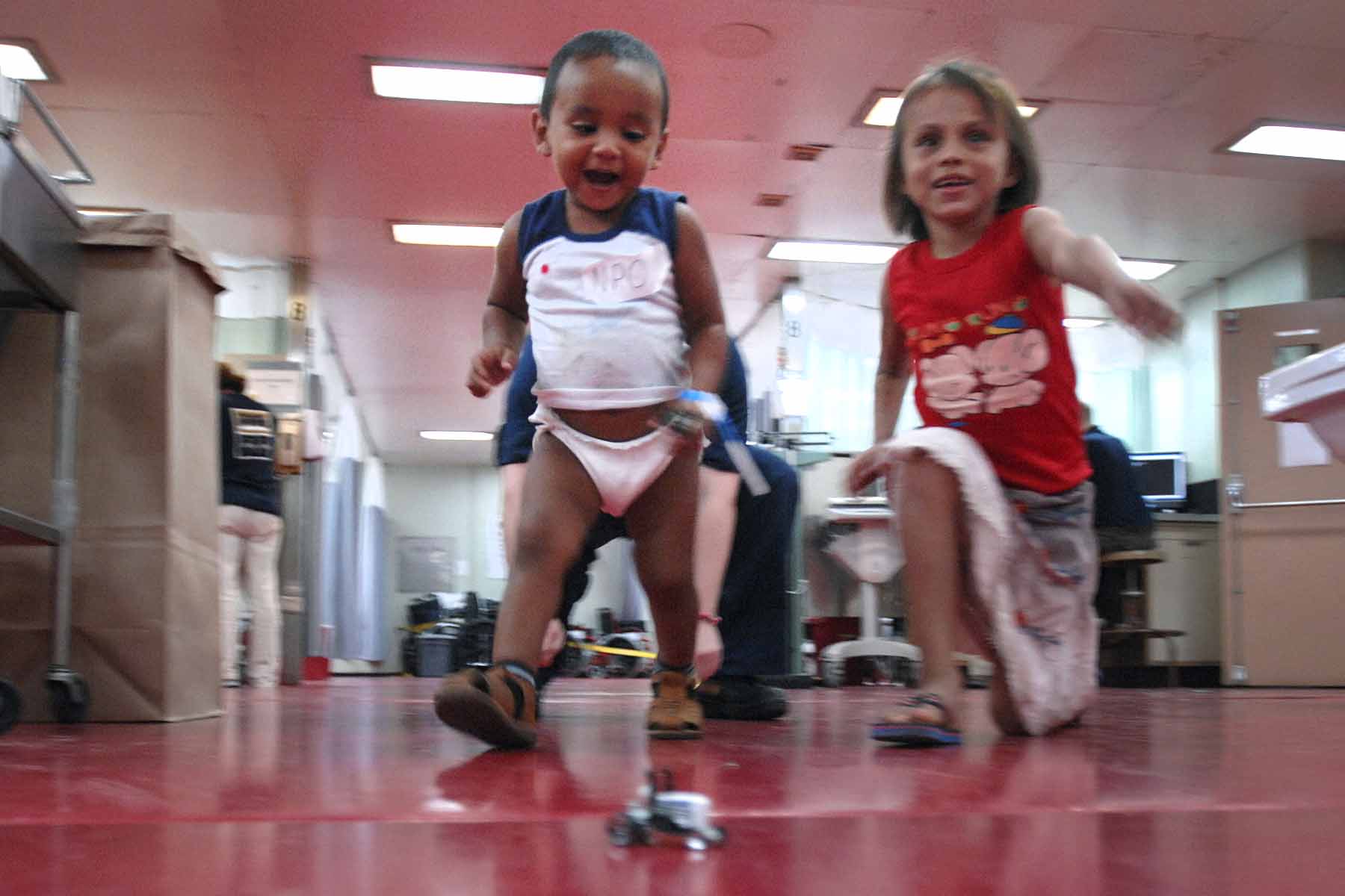 Beyker Maldonado and his friend chase a toy car July 10, 2009 ...