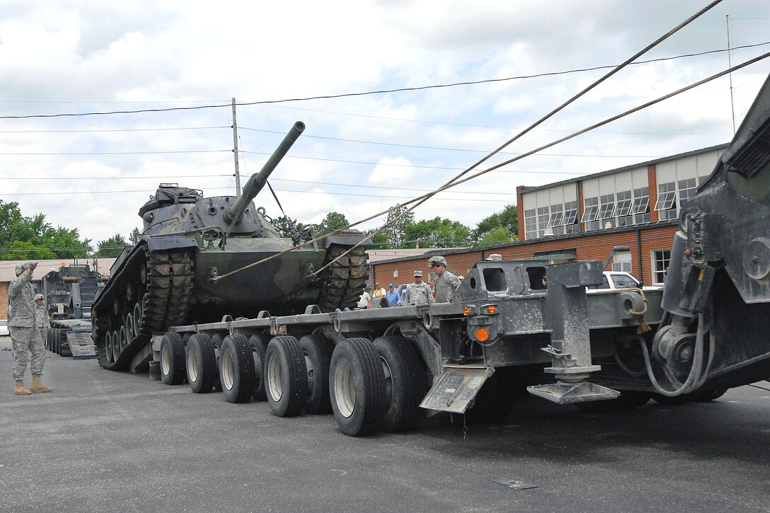 U.S. Army soldiers upload an M60 Patton Tank onto a vehicle designed to transport heavy equipment at the National Guard Armory in Bluffton, Ind., June 30, 2009. 