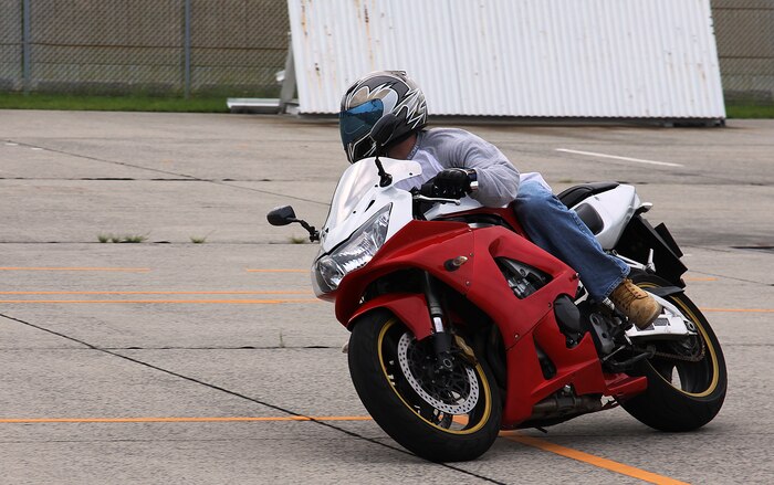 Sgt. James Hardenbrook leans in for a sharp turn during the Military Sportbike Riders Course here July 13. Course instructors said most sportbike accidents happen in corners where riders run off the road and hit a fixed object.