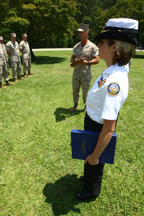 The Naval Junior Reserve Officers Training Corps with Cape Fear High School presented the Staff Non Commissioned Officers Academy with a letter of commendation signed by the high school’s principal as well as a plaque for their ‘exceptional loyalty and performance of duty over the years,’ July 14. For several years, Marines with the academy have been donating their time to help students with the Navy JROTC during their drill competitions. The Marines served as judges for these events. ::n::