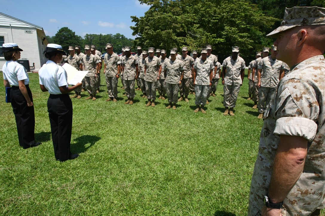 The Naval Junior Reserve Officers Training Corps with Cape Fear High School presented the Staff Non Commissioned Officers Academy with a letter of commendation signed by the high school’s principal as well as a plaque for their ‘exceptional loyalty and performance of duty over the years,’ July 14. For several years, Marines with the academy have been donating their time to help students with the Navy JROTC during their drill competitions. The Marines served as judges for these events. ::n::