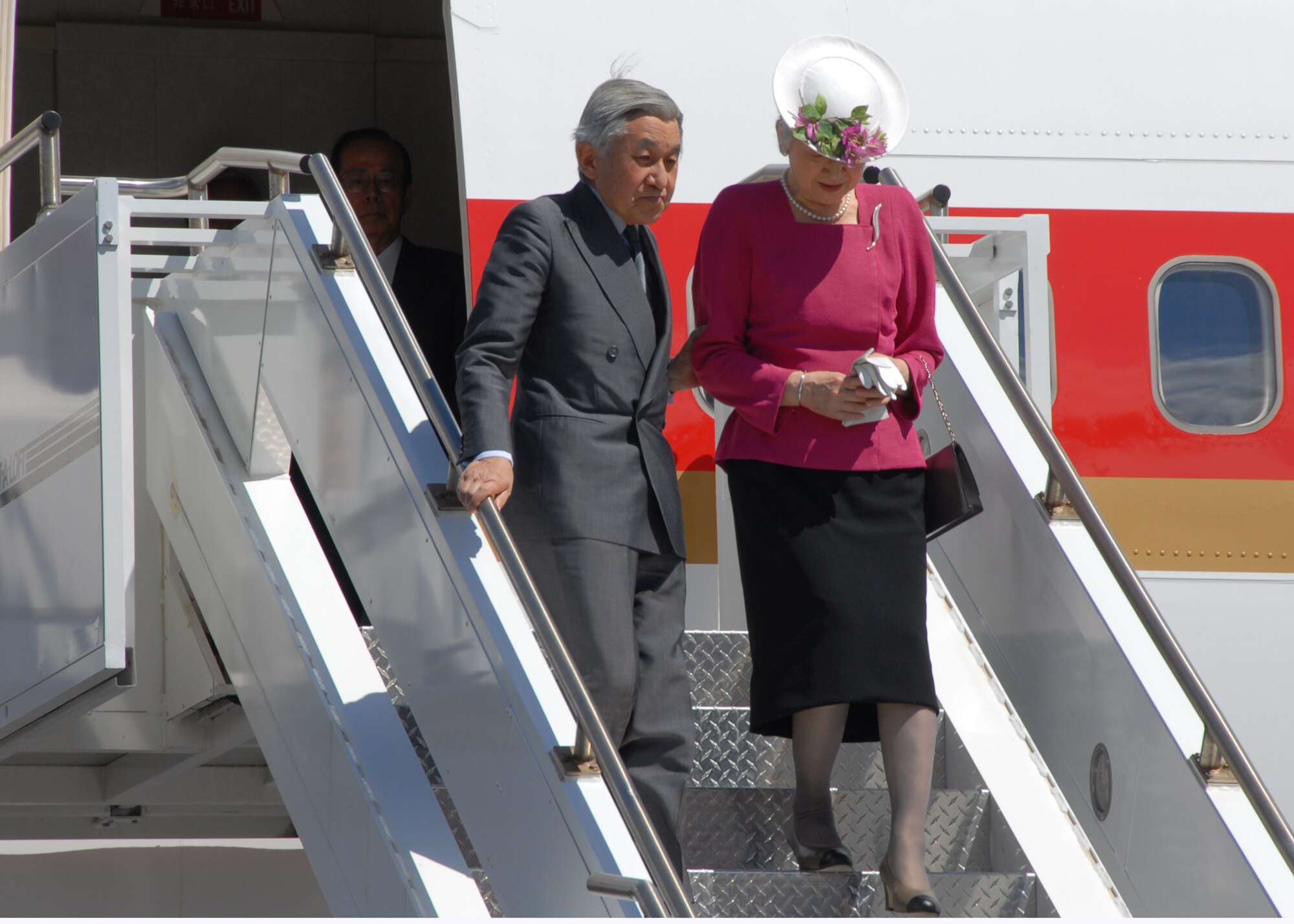 Emperor Akihito and Empress Michiko, the Royal Couple of Japan, arrive at Hickam Air Force Base, Hawaii, July 14 during a visit to the state. In place to greet them were Navy Adm. Timothy Keating, U.S. Pacific Command commander, Hawaii Gov. Linda Lingle and Col. Giovanni Tuck, 15th Airlift Wing commander. Emperor Akihito and Empress Michiko are also scheduled to lay a wreath at the National Memorial Cemetery of the Pacific during their visit. (U.S. Air Force photo/Staff Sgt. LuCelia Ball)