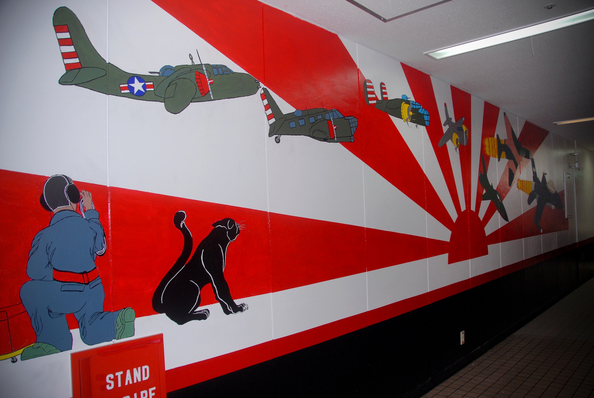 MISAWA AIR BASE, Japan – The mural painted on a 13th Aircraft Maintenance Unit wall pays tribute to the squadron’s history. Planes are in sequence from the earliest flown aircraft to present. (U.S. Air Force photo/Senior Airman Stefanie Torres)