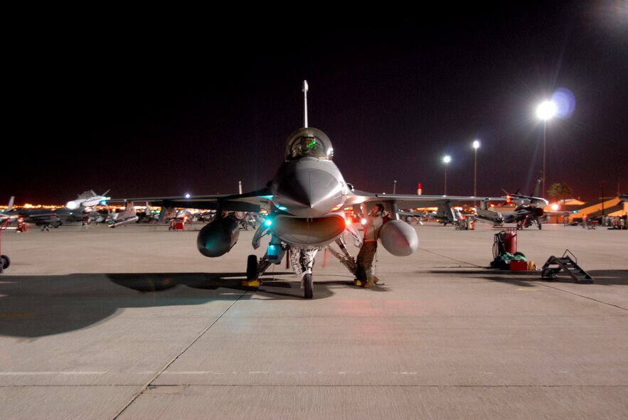 TSgt Ken Caldwell, aircraft mechanic from the 180th Fighter Wing, Ohio Air National Guard, prepares to launch out an F-16 CG during a Red Flag exercise. Members of the 180th are currently deployed to Nellis AFB to participate in a Red Flag exercise. Red Flag exercises are intended to provide the most realistic training environments for the United States and allied air forces.Members of the 180th Fighter Wing, Ohio Air National Guard, are currently deployed to Nellis AFB to participate in a Red Flag exercise. Red Flag exercises are intended to provide the most realistic training environments for the United States and allied air forces.