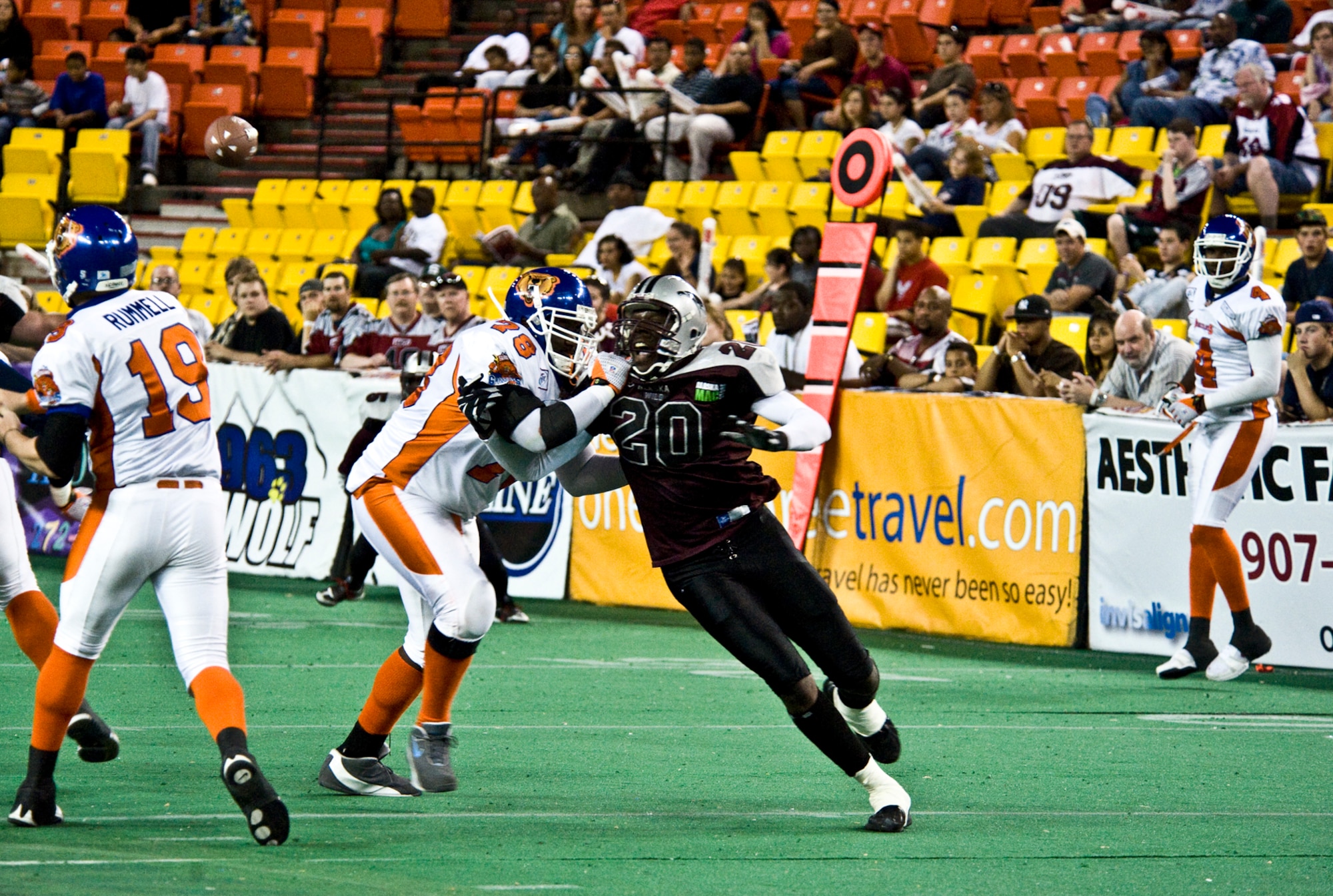 ANCHORAGE, Alaska comes around the corner in attempt to knock down Fairbanks Grizzlies quarterback during a game July 9. The Grizzlies topped the Wild 54-25. (U.S. Air Force photo/Airman 1st Class Christopher Gross)