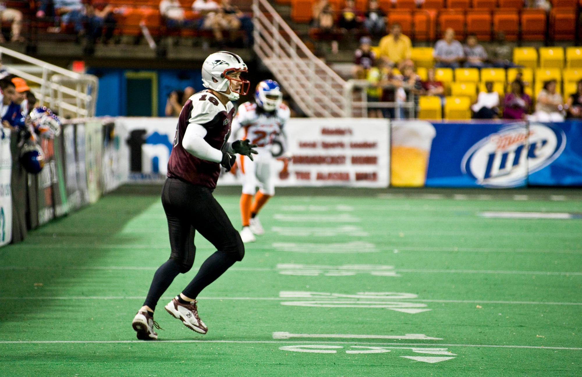 ANCHORAGE, Alaska -- Jeff Tongate, kicker and reciever for the Alaska Wild, looks back at the quarterback as he settles down to catch the ball during the season finale game against the Fairbanks Grizzlies July 9. The Grizzlies topped the Alaska Wild 54-25. Tongate is a technical sergeant assigned to the Elmendorf Fire and Emergency Services. (U.S. Air Force photo/Airman 1st Class Christopher Gross)