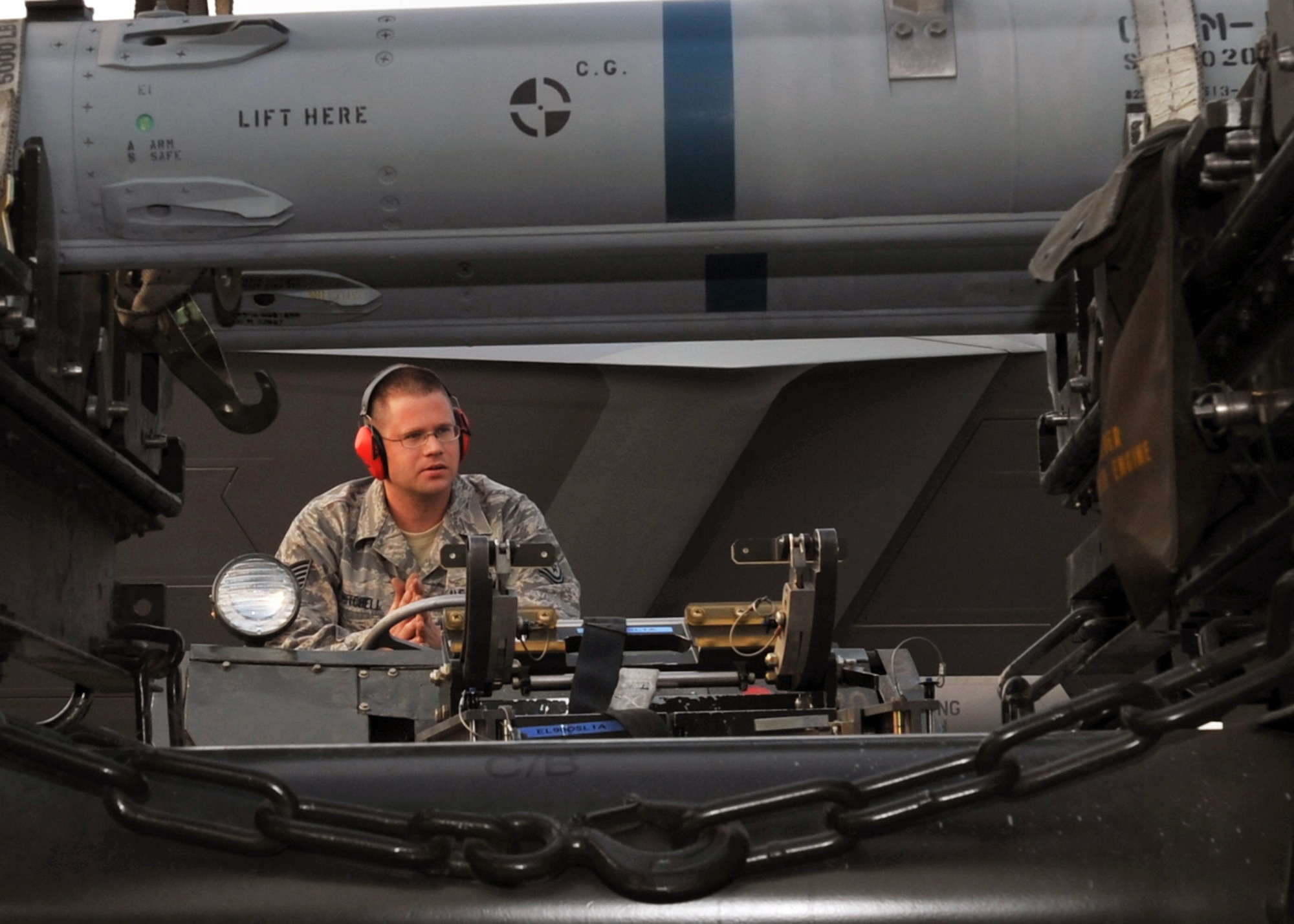 ELMENDORF AIR FORCE BASE, Alaska -- Tech. Sgt. Michael Mitchell awaits members of his crew to load the next missile during a load crew competition July 10. The purpose of the competition is to demonstrate and be tested on quick turn weapon loads. Mitchell is a member of the 477th Aircraft Maintenance Squadron. (U.S. Air Force photo/Senior Airman Laura Turner)