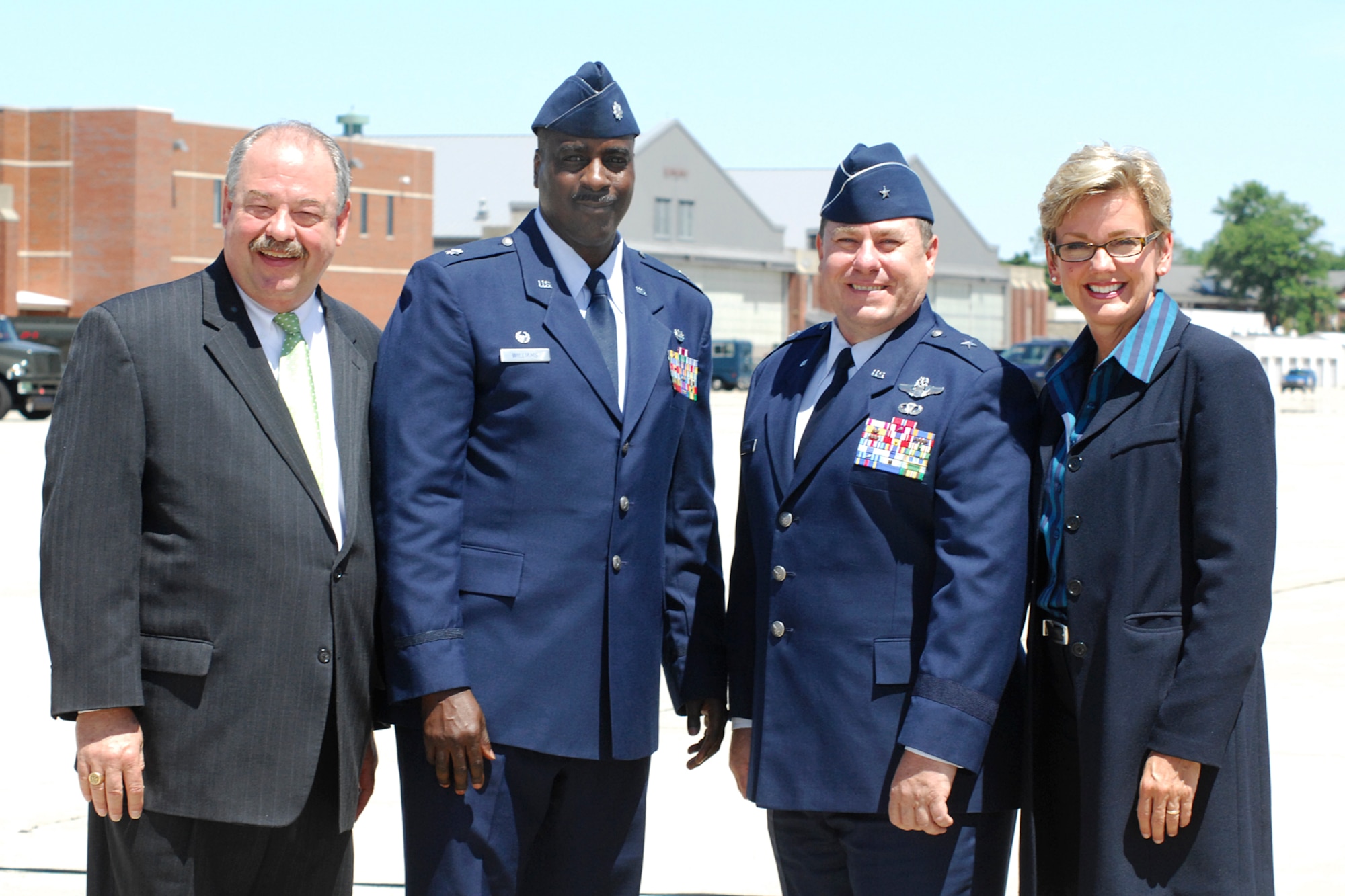 Michigan Governor Jennifer Granholm, Lt. Governor John Cherry, 127th Wing Commander Brig. Gen. Michael Peplinski, and 127th Mission Support Group Commander Lt. Col. Rodney Williams pose for a photo while they awaited the arrival the President at Selfridge Air National Guard Base.  Air Force One landed at Selfridge Air National Guard Base on Tuesday, July 14,  with the President and Senator Debbie Stabenow, on his way to a public appearance at Macomb County Community College in Warren, Mich., where he announced his American Graduation Initiative.  (USAF photo by John S. Swanson)