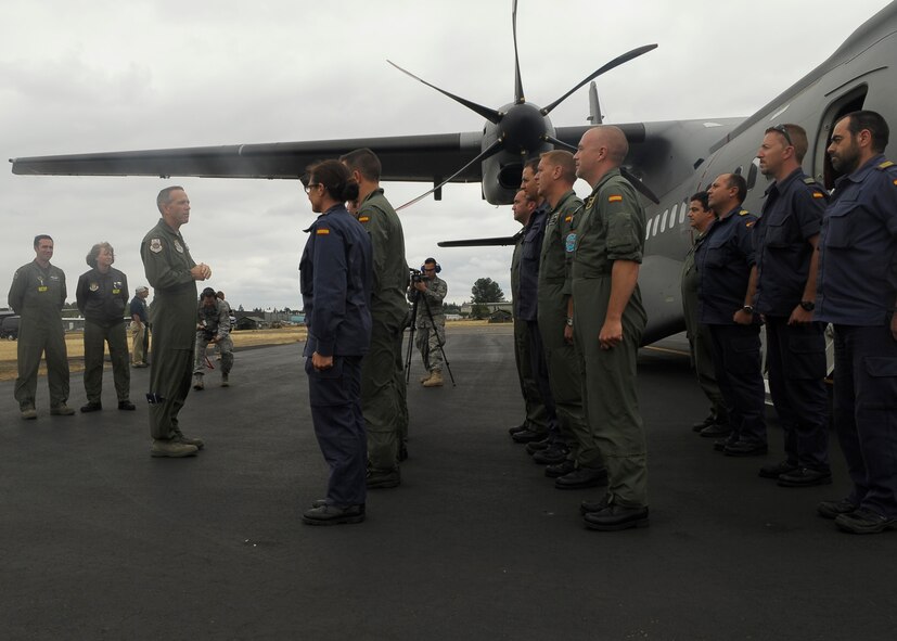 U.S. Air Force Maj. Gen. Brooks Bash, director of Air, Space and Information Operations, Scott Air Force Base, Ill., greets the Spanish air force team upon its arrival at McChord July 13. The Spanish team has come to McChord to compete in the Air Mobility Command's Rodeo 2009. This is an international competition that focuses on improving worldwide air mobility forces' professional core abilities. (U.S. Air Force photo/Senior Airman Dayton Mitchell)  