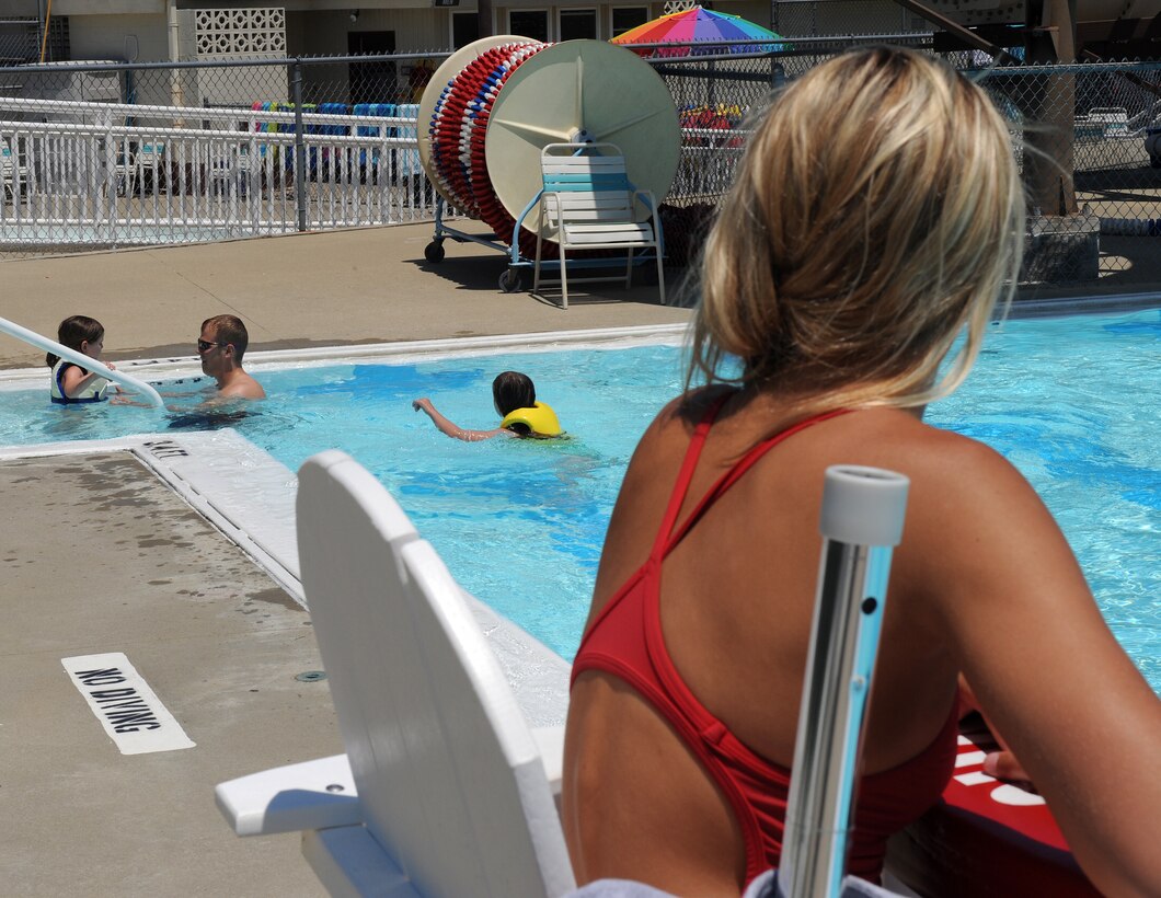 LANGLEY AIR FORCE BASE, Va. -- Brittany Ables, Langley lifeguard, watches over the swimmers at the base pool July 14.  On-duty lifeguards is one way that Langley provides water safety for the swimmers. (U.S. Air Force photo/Senior Airman Zachary Wolf)