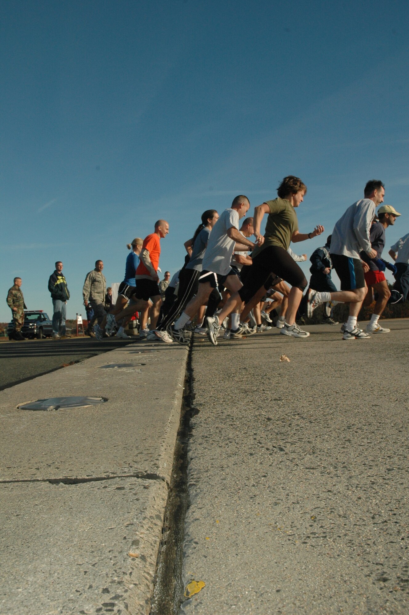 Reservists at Westover ARB participate in a run on the flight line to raise funds for the Combined Federal Campaign. 