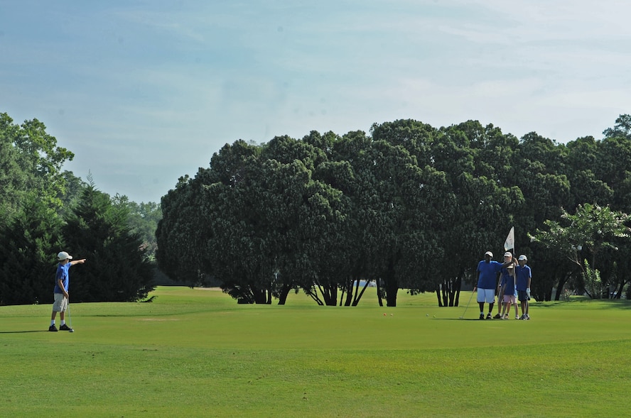 Air Combat Command/ United States Kids Golf program includes full swing, pitching, chipping, sand shots, putting and etiquette. Five days are spent on the practice range and one day on the golf course. (U.S photo/ Airman 1st Class Brittany Y. Bateman)