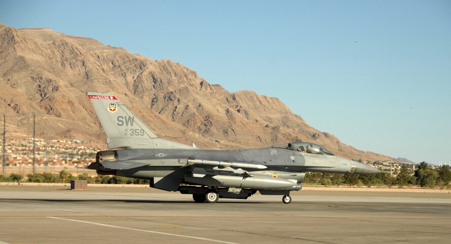 NELLIS AIR FORCE BASE, Nev. -- A 77th Fighter Squadron F-16CJ from Shaw Air Force Base taxis back from a training mission at Red Flag 09-4. Annually, Red Flag exercises attract more than 200 units utilizing about 750 aircraft and about 12,000 Airmen to fly more than 10,000 sorties. (U.S. Air Force photo/2nd Lt. Emily Chilson)