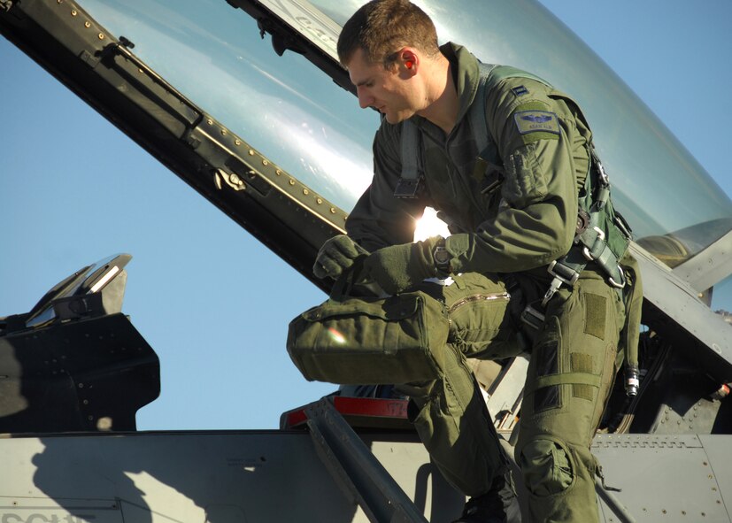 NELLIS AIR FORCE BASE, Nev. -- Captain Adam Alm, 77th Fighter Squadron F-16CJ pilot, returns from a training mission during Red Flag 09-4. Red Flag is a comprehensive and highly-realistic combat training exercise that pits U.S. and allied nation air forces against 'enemy' forces in a challenging air, ground, cyberspace and electronic threat environment. (U.S. Air Force photo/2nd Lt. Emily Chilson)