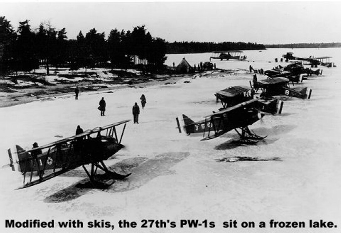 Modified with skis, the 27th Aero Squadron's PW-1's sit on a frozen lake.