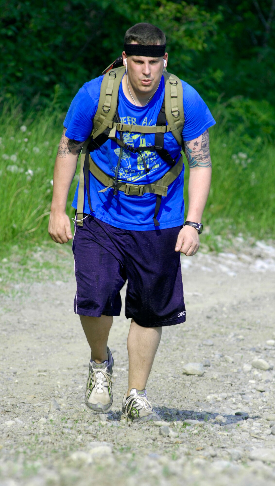 ELMENDORF AIR FORCE BASE, Alaska -- A participant begins the four-mile wieghted backpack hike, the last obstacle of the challenge, July 10. The hike was one of four events during the 5th annual Eco Challenge. The other events included runniing, biking and kayaking. (U.S. Air Force photo/Airman 1st Class Christopher Gross)