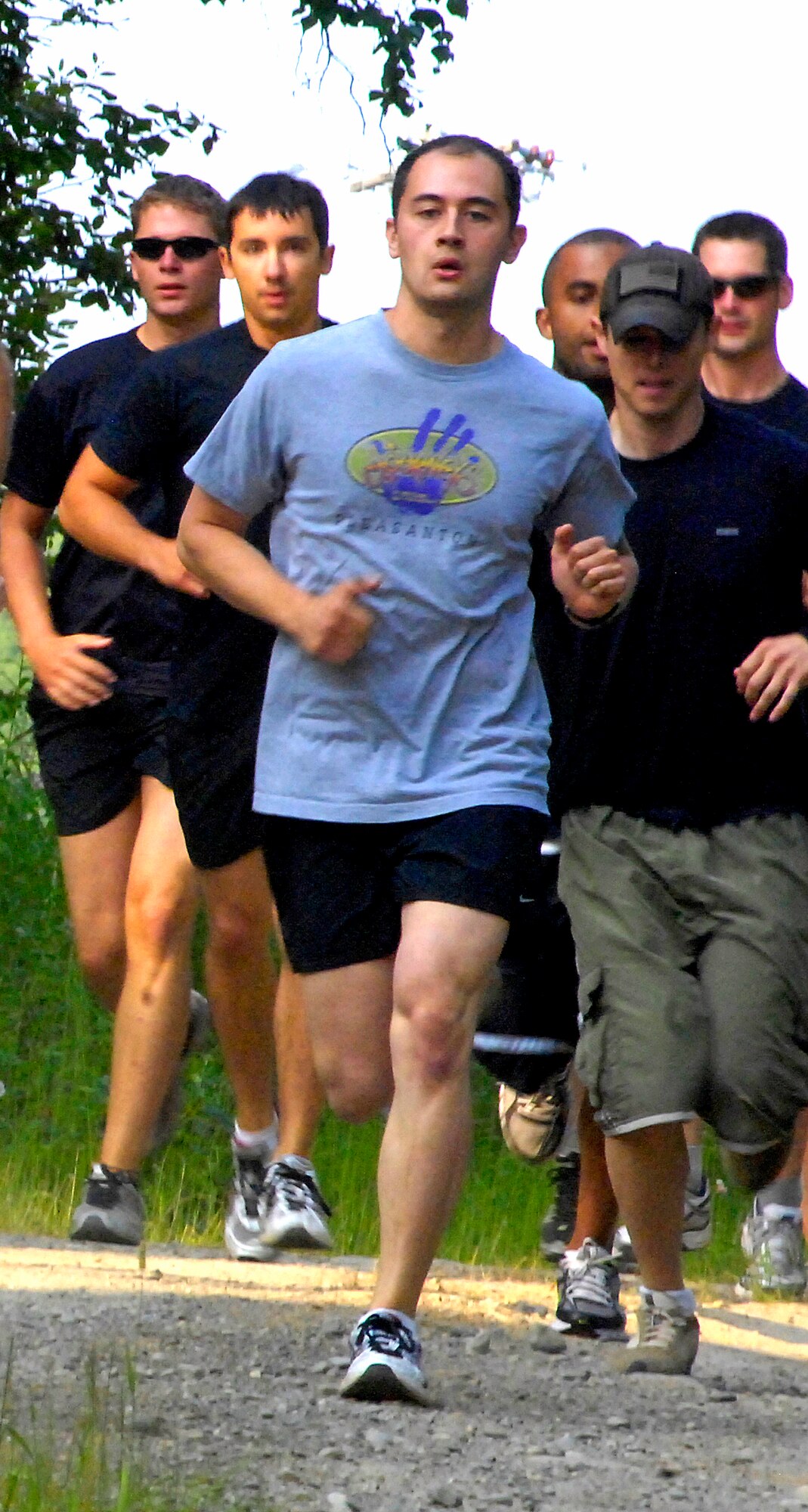 ELMENDORF AIR FORCE BASE, Alaska -- Jonathon Abraham leads a pack of several participants at the start of the 4.5-mile run July 10. The run was one of four events during the 5th annual Eco Challenge. The other events included biking, kayaking and a hike with a weighted backpack. Abraham is a member of the 16th Air Support Operations Squadron here. (U.S. Air Force photo/Airman 1st Class Christopher Gross)