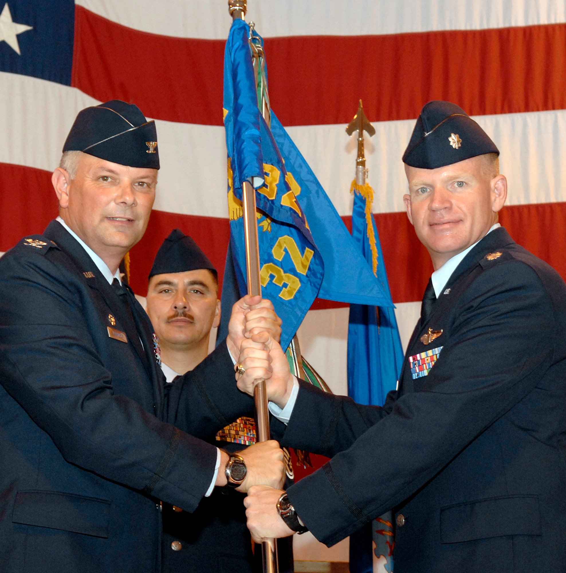 Lt. Col. Darrell Judy, right, accepts command of the 32nd Flying Training Squadron from Col. Glen VanHerck, 71st Operations Group commander, during a ceremony held July 9 in Hangar 170 at Vance AFB, Okla. Colonel Judy has served as Vance’s chief of Wing Safety, and recently returned from Pilot Instructor Training at Randolph AFB, Texas. He replaced Lt. Col. David Morrissey who was reassigned to Stuttgart, Germany. (U.S. Air Force photo/ Terry Wasson