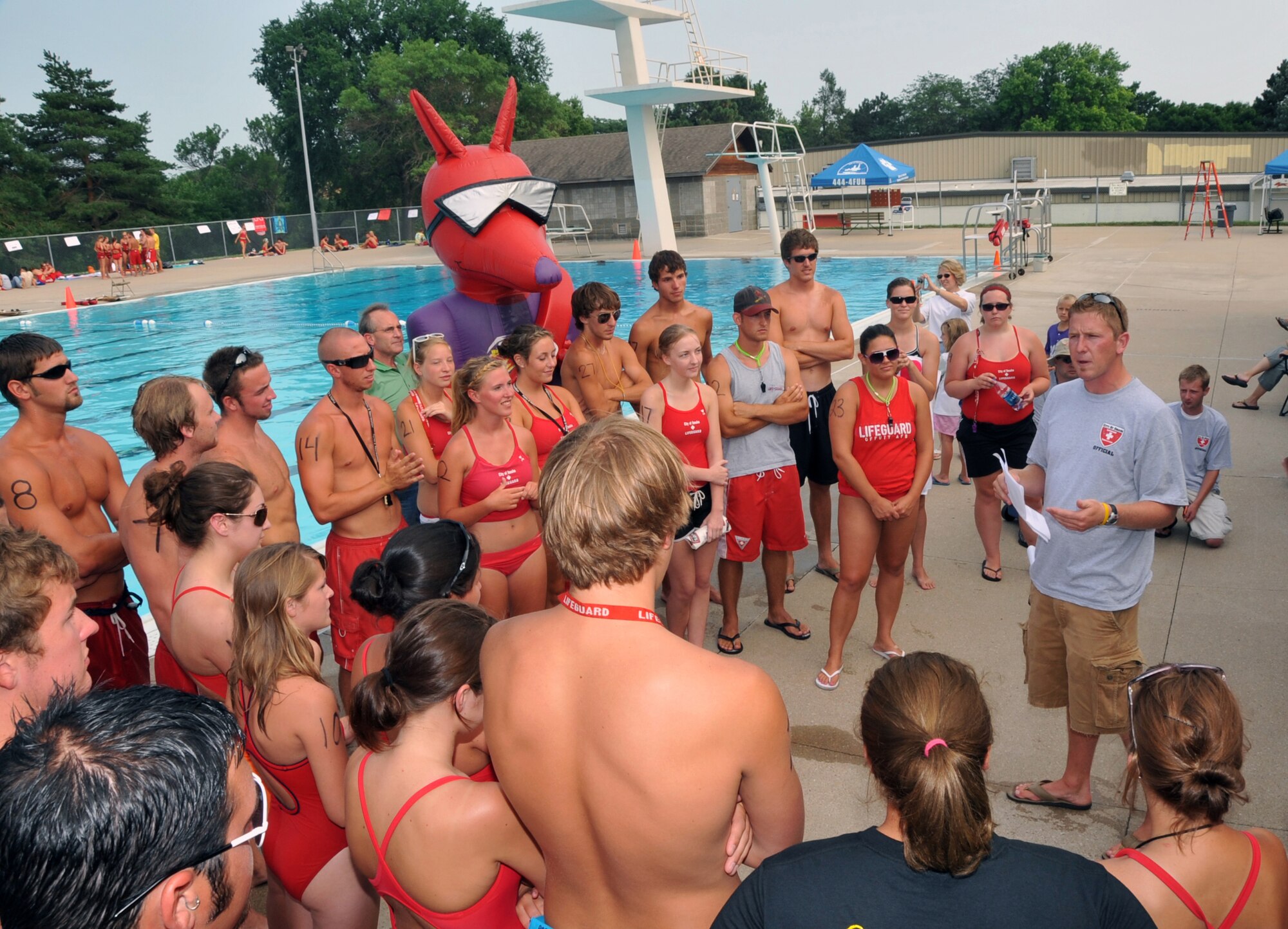 OFFUTT AIR FORCE BASE, Neb. -- Lifeguards from Offutt and pools throughout the state listen as instructors explain the rules for the 2009 Nebraska State Lifeguard Competition held at Hitchcock Pool in Omaha July 10. U.S. Air Force Photo by Jeff W. Gates