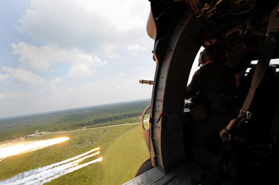 MOODY AIR FORCE BASE, Ga. -- Senior Master Sgt. Michael Stone, 41st Rescue Squadron aerial gunner, fires a GAU-A/B 7.62mm minigun during training. (U.S. Air Force photo by Senior Airman Gina Chiaverotti)