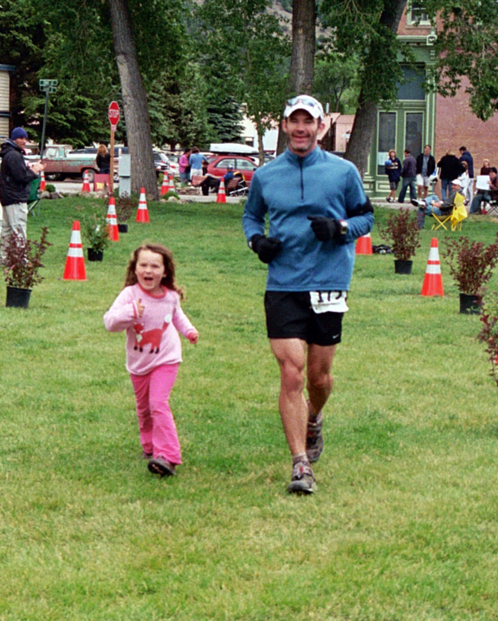 Maj. Jason “Santini” Smith, and his 5-year-old daughter, complete the final 100 feet of the San Juan Solstice 50-mile run, June 20, in Lake City, Colo. Major Smith, a T-38 instructor pilot with the 25th Flying Training Squadron at Vance AFB, Okla., is training for the Leadville Trail 100-mile ultramarathon, Aug. 22, also in Colorado. (Courtesy photo/ Leah Smith)