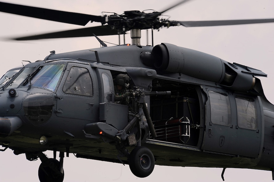MOODY AIR FORCE BASE, Ga. -- A 41st Rescue Squadron aerial gunner prepares to fire his GAU-2/A 7.62mm minigun. Aerial gunners must meet requirements to stay completely qualified. (U.S. Air Force photo by Senior Airman Gina Chiaverotti)