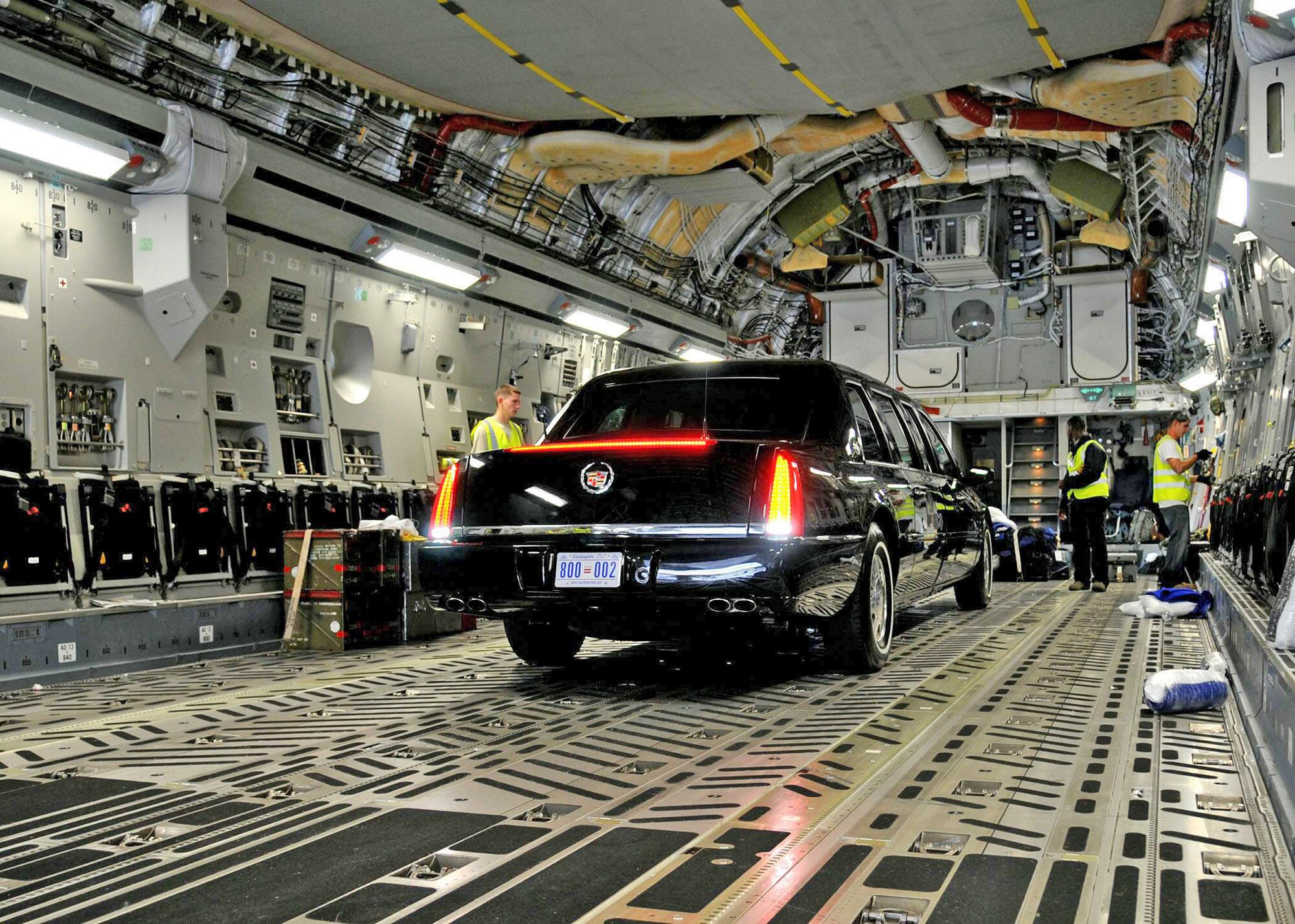 Airmen from the 621st Contingency Response Wing assist aircrew personnel in offloading a presidential limousine from a C-17 Globemaster III at Kotoka International Airport July 8 at Accra, Ghana. The Airmen were among more than 150 Airmen, Sailors and Marines in Ghana and Sailors aboard the USS Iwo Jima who make up a task force supporting President Barack Obama's visit July 10 and 11. Airmen of the 621st CRW are from at McGuire AFB, N.J. (U.S. Air Force photo/Staff Sgt. Jerry Fleshman) 
