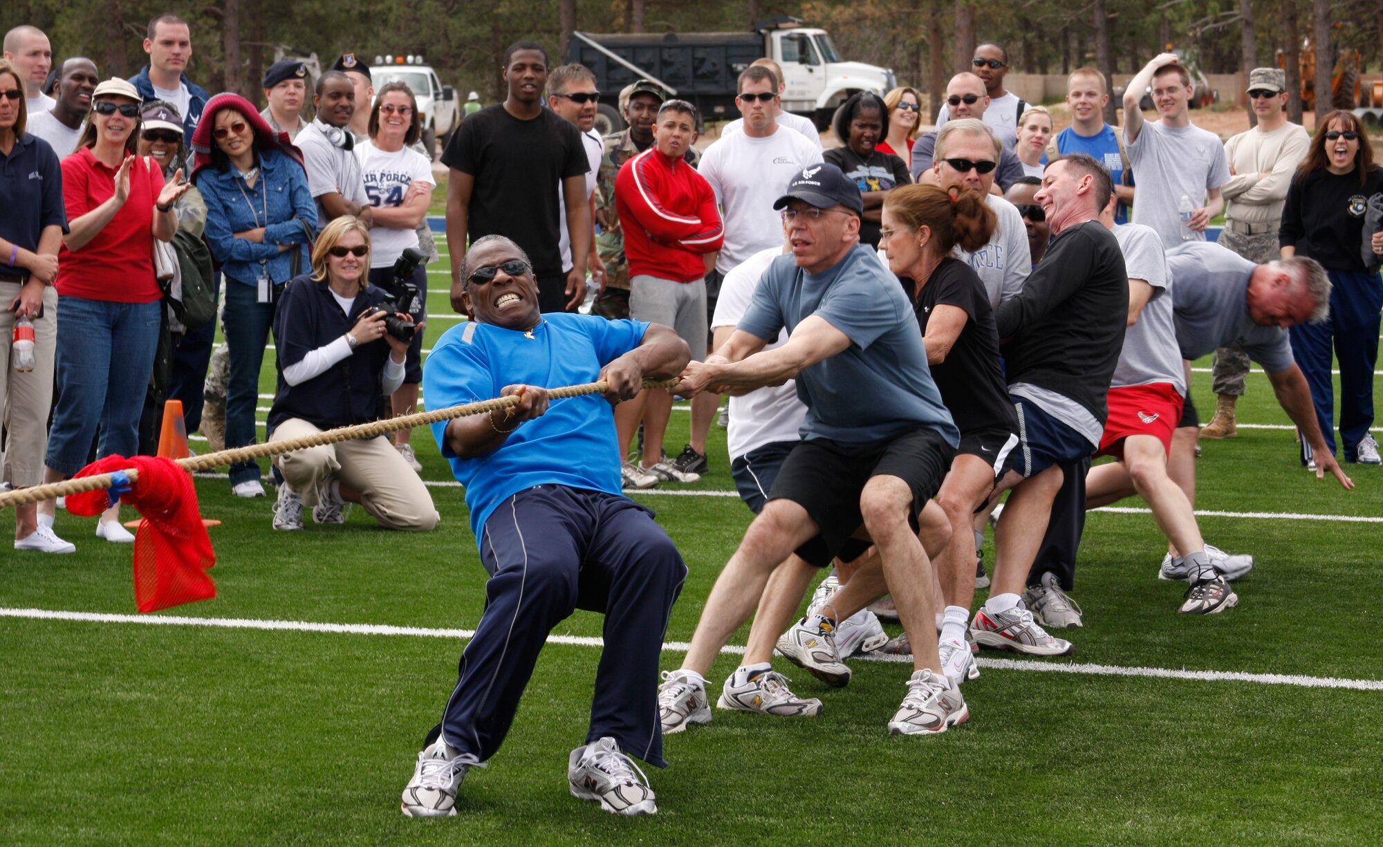 Col. Jimmy McMillian spontaneously called for all Clash of the Titans competitors 45 and older to square off against one another for fun after the official Titans Challenge tug-of-war competition. The 10th Security Forces Team 2 claimed the top spot in the event. Colonel McMillian is the 10th Air Base Wing commander. (U.S. Air Force photo/Ken Carter)