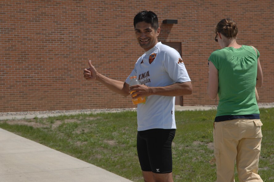 MINOT AIR FORCE BASE, N.D. – Capt. Doug Rodriguez from the 23th Bomb Squadron gives the thumbs up after he completed the triathlon here July 11. Men and women, civilian and military from across the base participated in the triathlon. The triathlon consists of an one-half mile swim, ten kilometer bicycling, and a five kilometer run.  The 5th Force Support Squadron organized the event to promote physical fitness and team building. (U.S. Air Force photo by Staff Sgt. Angel Gallardo)