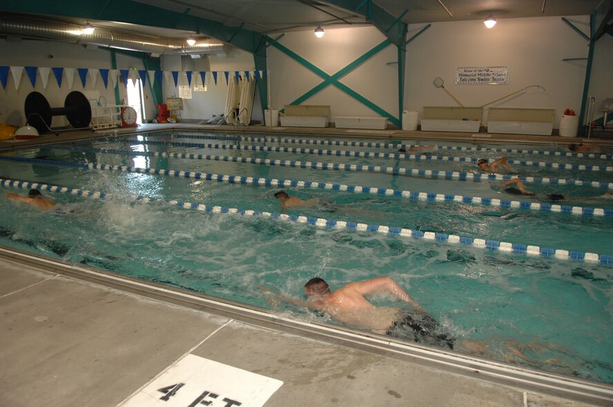 MINOT AIR FORCE BASE, N.D.  -- Triathlon athletes swim in the first part of a triathlon July 11. The triathlon consisted of an one-half mile swim, ten kilometer bicycling, and a five kilometer run. Men and women, civilian and military, from across the base participated in the triathlon. The 5th Force Support Squadron organized the event to promote physical fitness and team building. (U.S. Air Force photo by Staff Sgt. Angel Gallardo)