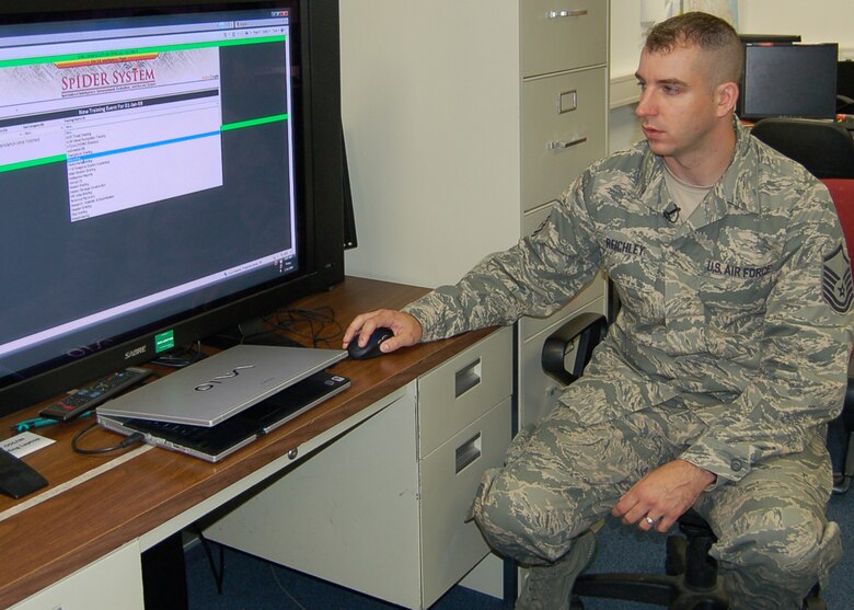 SPANGDAHLEM AIR BASE, Germany -- Master Sgt. Erich Reichley, 52nd Operations Support Squadron NCOIC of intelligence operations, monitors training progress in his shop through the Specialized Intelligence Development, Evaluation and Record System. Sergeant Reichley created the “SpIDER System” for his shop to track training. He earned $10,000 for his efforts through the Innovative Development Through Employee Awareness Program. (U.S. Air Force photo by Tech. Sgt. Tammie Moore)
