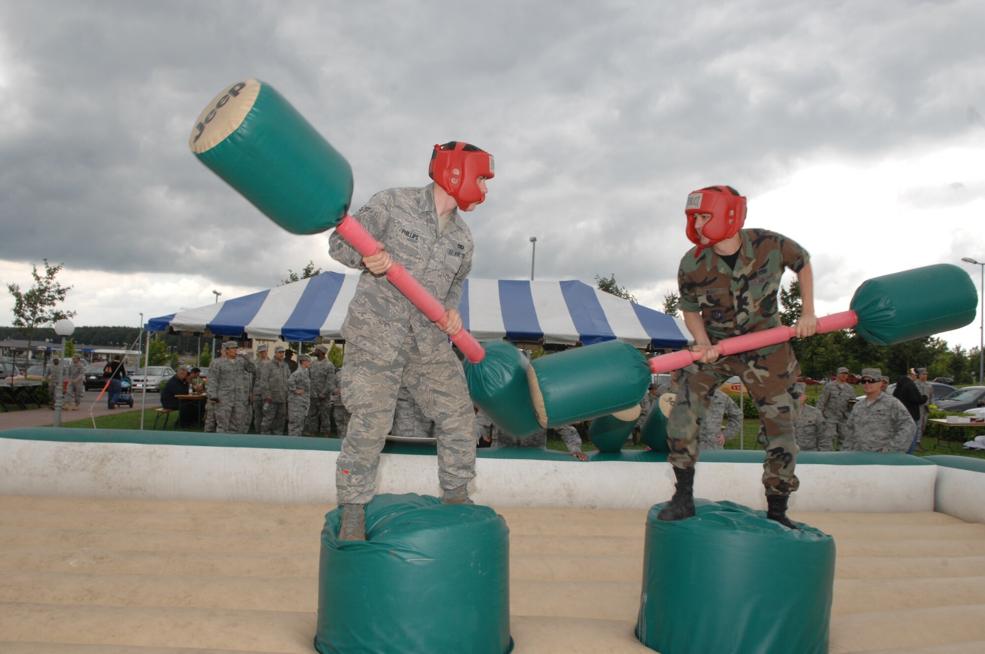 SPANGDAHLEM AIR BASE, Germany— From left to right, Airmen 1st Class Mathew Phillips and Justin Wray, both from the 52nd Equipment Maintenance Squadron, stand off against one another during the Jeep Jouster competition July 10. This was one of the activities that took place during the Unit Compliance and Logistical Standardization and Evaluation Program inspections celebration July 10. (U.S. Air Force photo by Airman 1st Class Nick Wilson)