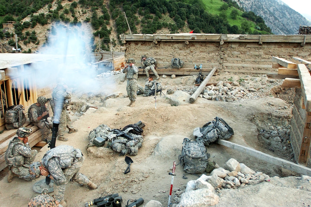 U.S. soldiers fire mortar rounds at suspected Taliban fighting positions during Operation Mountain Fire in Barge Matal, a village in Afghanistan’s Nuristan province, July 12, 2009. U.S. and Afghan forces secured the remote mountain village, which had been overwhelmed by insurgent forces several days before. U.S. Army photo by Sgt. Matthew C. Moeller