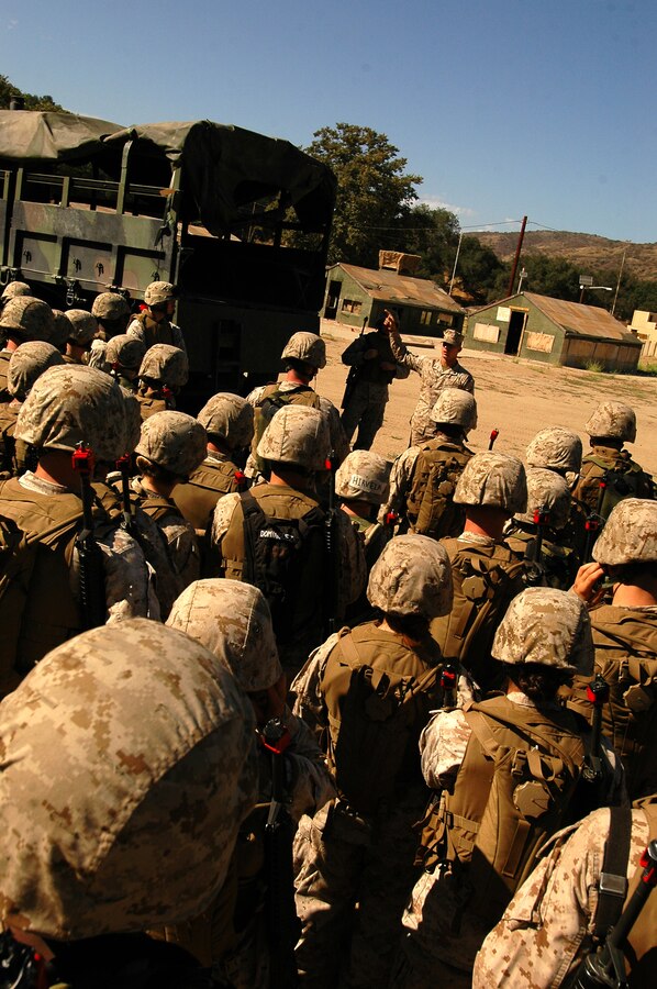 Course instructor Cpl. Nathaniel Brown teaches convoy security techniques to Yuma Headquarters and Headquarters Squadron Marines July 13, 2009, during the Enhanced Combat Skills course at Camp Pendleton, Calif. The Marines learned the proper way to debark a vehicle in a hostile environment.