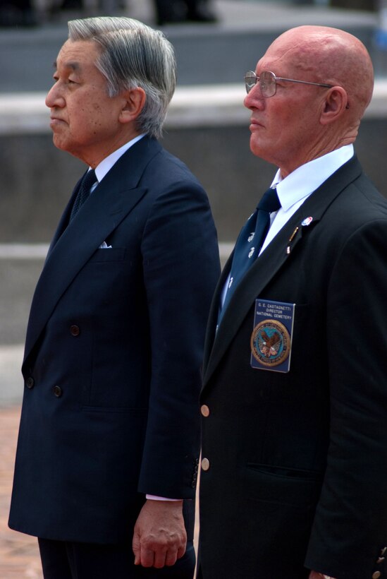 HONOLULU -Japanese Emperor Akihito and Retired Marine Col. Gene Castagnetti share a moment of silence at the National Memorial Cemetery of the Pacific (Punchbowl) July 15. During their stay, the imperial couple paid tribute to fallen service members with a wreath laying ceremony. Their July 14 arrival marks their first visit in more than 50 years.  Castagnetti is the Punch Bowl cemetery director (Official U.S. Marine Corps Photo by Sgt. Juan D. Alfonso)