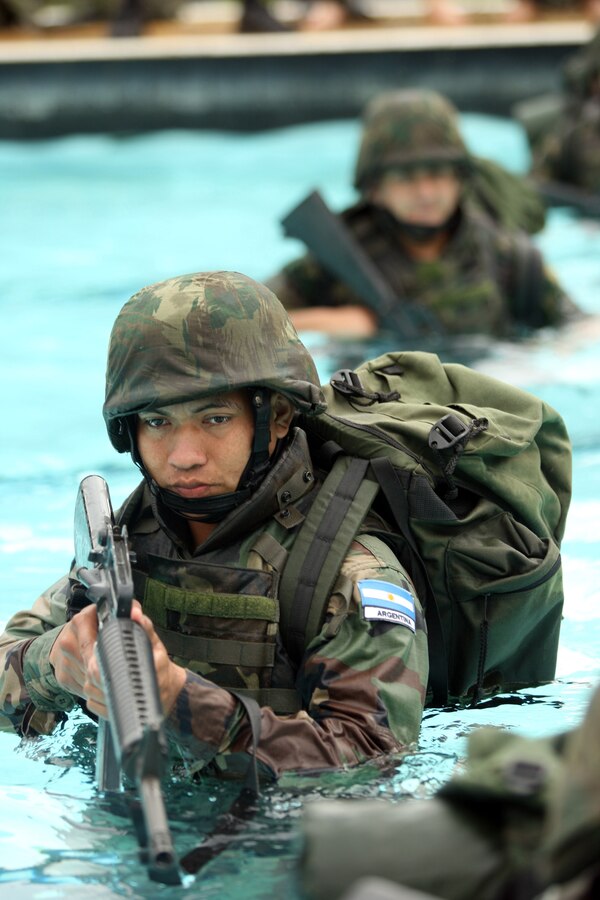 Marines from exercise Southern Exchange 2009 (SE09) took to the pool during combat water survival qualifications at the Governor's Island Naval Complex here, July 20. The training, which was taught by Colombian Marines was broken up into two levels; swimming in boots and utilities, and swimming with a full combat load. (USMC photo by Lance Cpl. Jonathan G. Wright/Released)