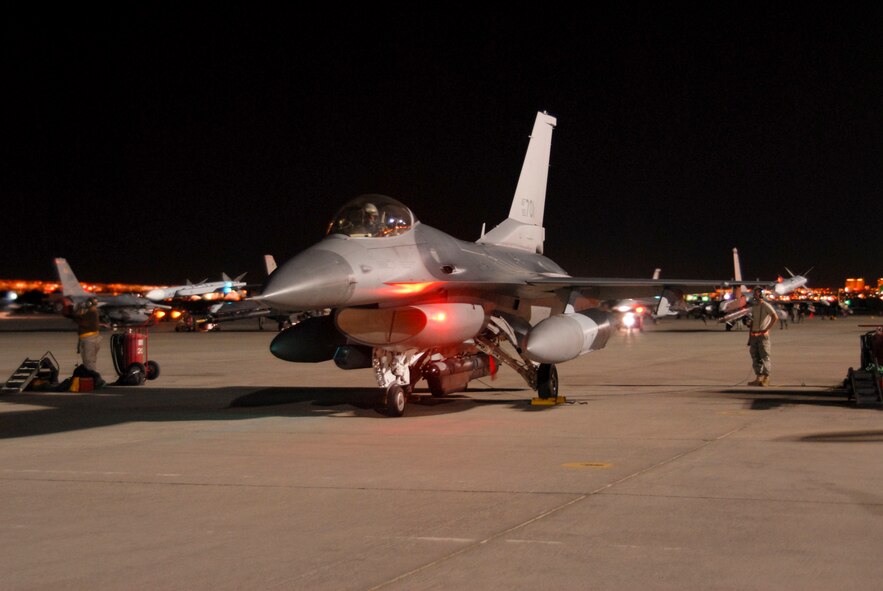 U.S. Air Force Tech. Sgt. Ken Caldwell, an aircraft mechanic assigned to the 180th Fighter Wing, Ohio Air National Guard, prepares to launch an F-16 Fighting Falcon aircraft from Nellis Air Force Base, Nev., July 12, 2009, during a Red Flag exercise. Red Flag exercises are designed to provide the most realistic training environments for United States and allied air forces. (U.S. Air Force photo by Tech. Sgt. Beth Holliker/Released)
