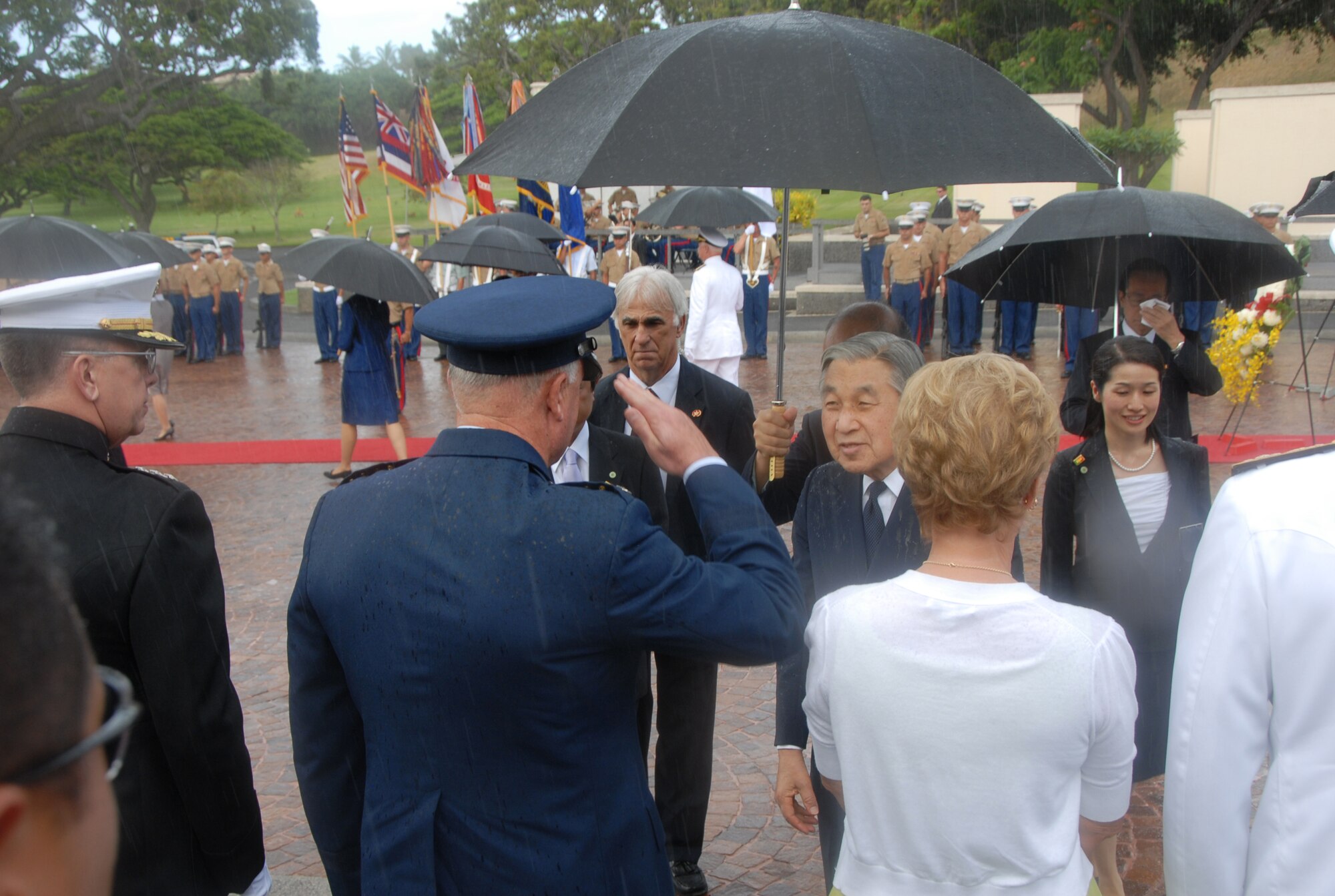 Gen. Howie Chandler, Pacific Air Forces commander, greets Emperor Akihito, Emperor of Japan, during a visit to the National Memorial Cemetery of the Pacific at Punchbowl Crater, Hawaii, July 15. The Emperor and his wife, Empress Michiko, paid homage to those interred at the cemetary by laying a wreath. More than 50,000 service men and women are interred at the cemetery. (U.S. Air Force photo/Staff Sgt. LuCelia Ball)