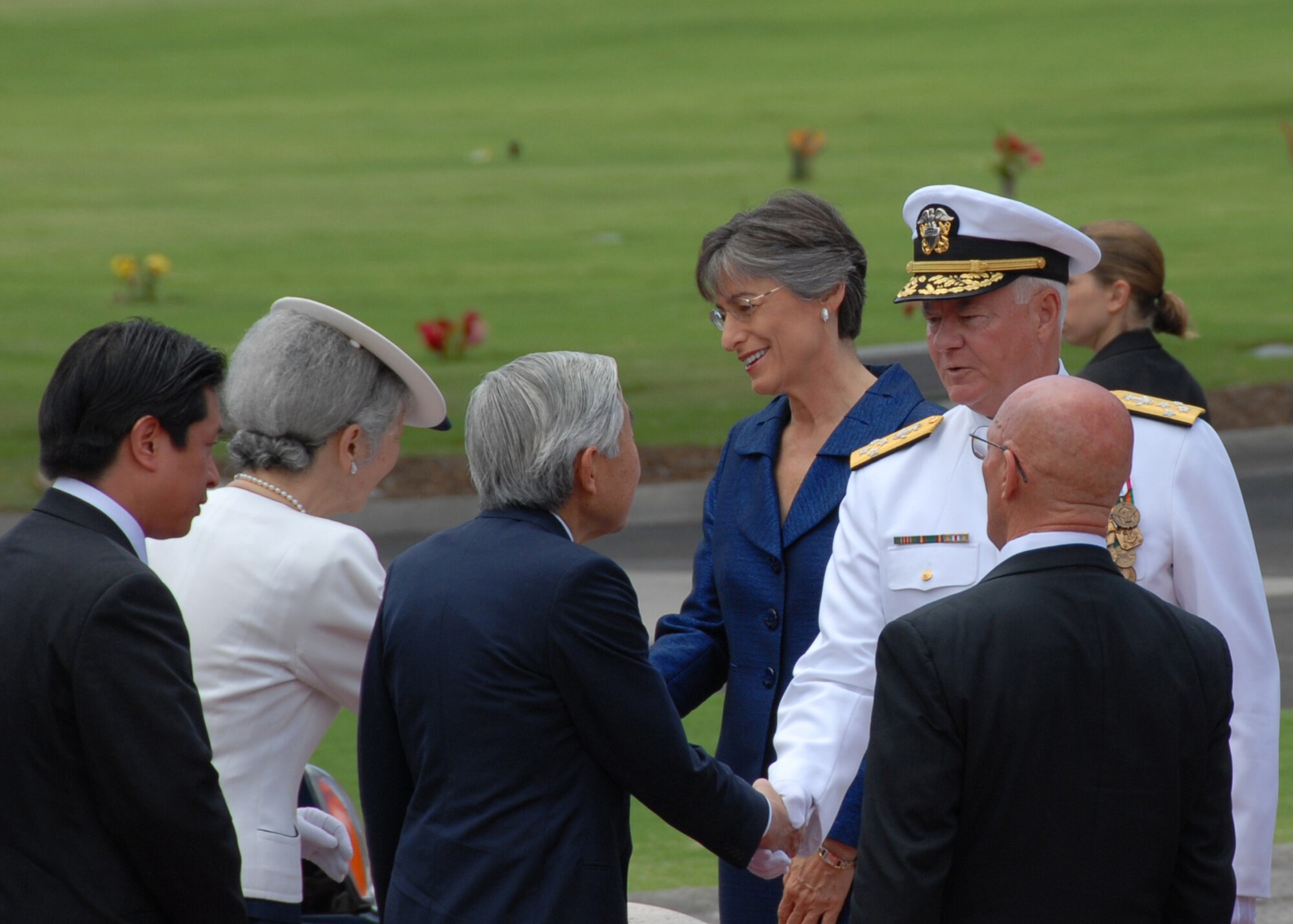 Adm. Timothy Keating, U.S. Pacific Command commander, greets the Emperor of Japan at the National Memorial Cemetery of the Pacific at Punchbowl Crater, Hawaii, July 15. Emperor Akihito and Empress Michiko paid tribute to those interred at the cemetery by laying a chrysanthemum wreath in a ceremony also attended by Hawaii Gov. Linda Lingle and Pacific Air Forces commander, Gen. Howie Chandler. The ceremony also included a 21-gun salute, a joint flyover by U.S. Navy and Japan Self Defense Forces aircraft and the playing of "Taps." More than 50,000 service men and women are interred at the cemetery. (U.S. Air Force photo/Staff Sgt. LuCelia Ball)
