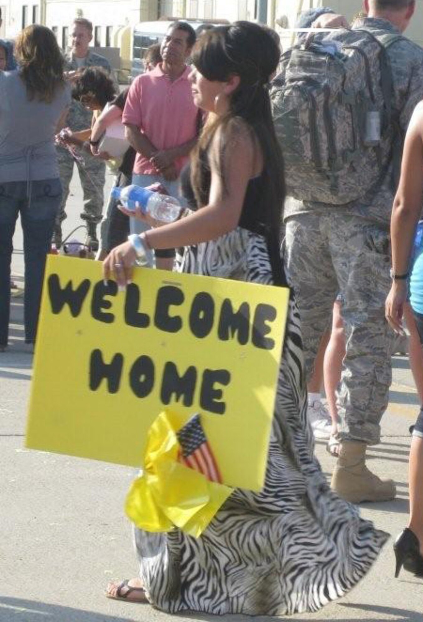 Family and friends were staged on the flight line to greet thirty Security Forces Airmen as their plane landed Saturday.  The Airmen were returning from a six-month deployment to Kirkuk Air Base in Iraq. (U.S. Air Force photo by Capt. Anna Ruiz)