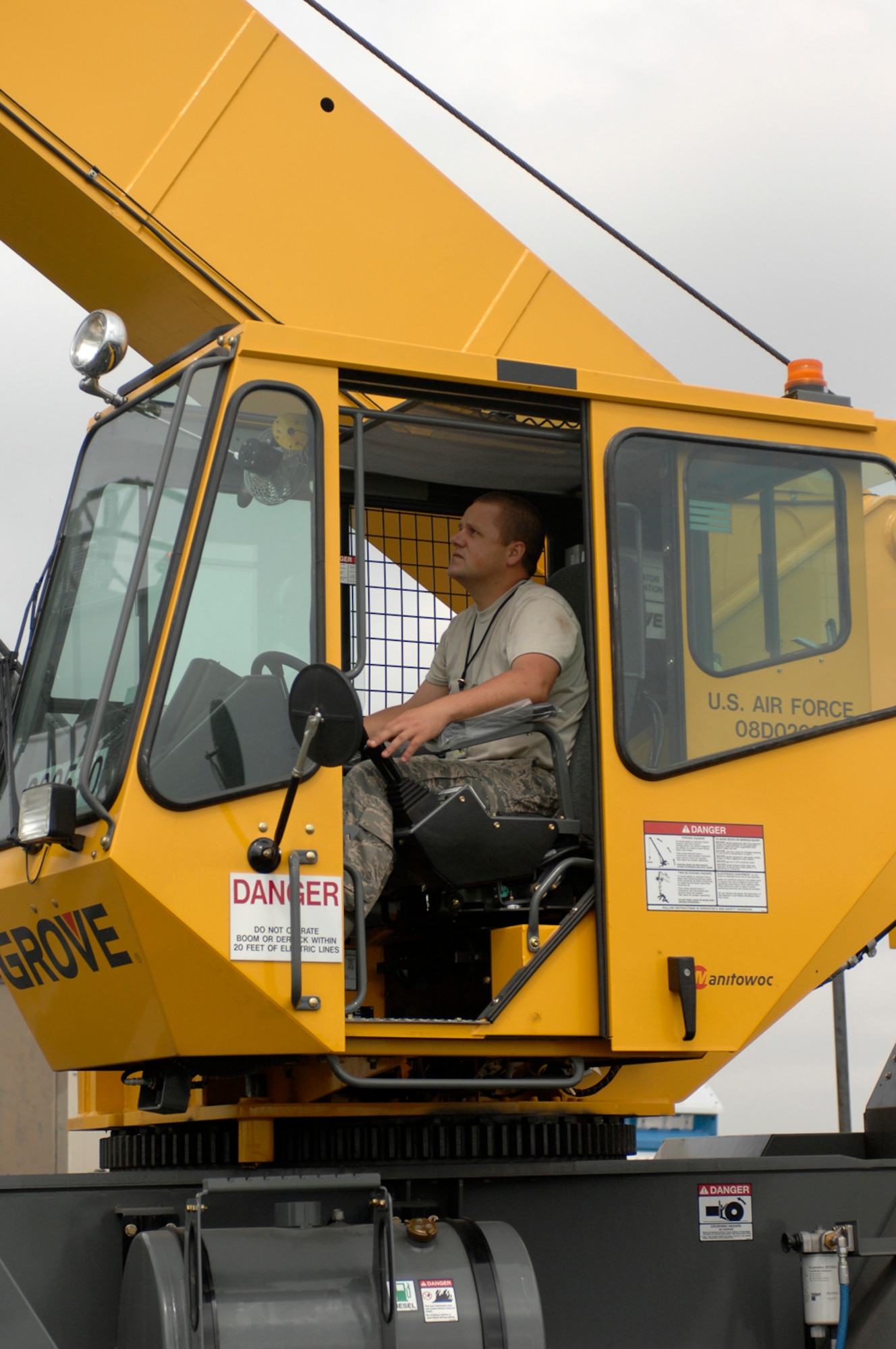 WHITEMAN AIR FORCE BASE, Mo. - Tech. Sgt. Jesse Perkins, 509th Maintenance Squadron, positions a crane July 13 to remove an old tactical navigation antenna to prepare for installation of a newer, and larger, model. The $1.5 million project is scheduled to be completed July 21. 
The new antenna will provide increased up-time allowing launch and recovery of aircraft day or night in any kind of weather, said 1st Lt. Donald Roley, 509th Operations Support Squadron. (U.S. Air force photo/Staff Sgt. Jason Barebo)
