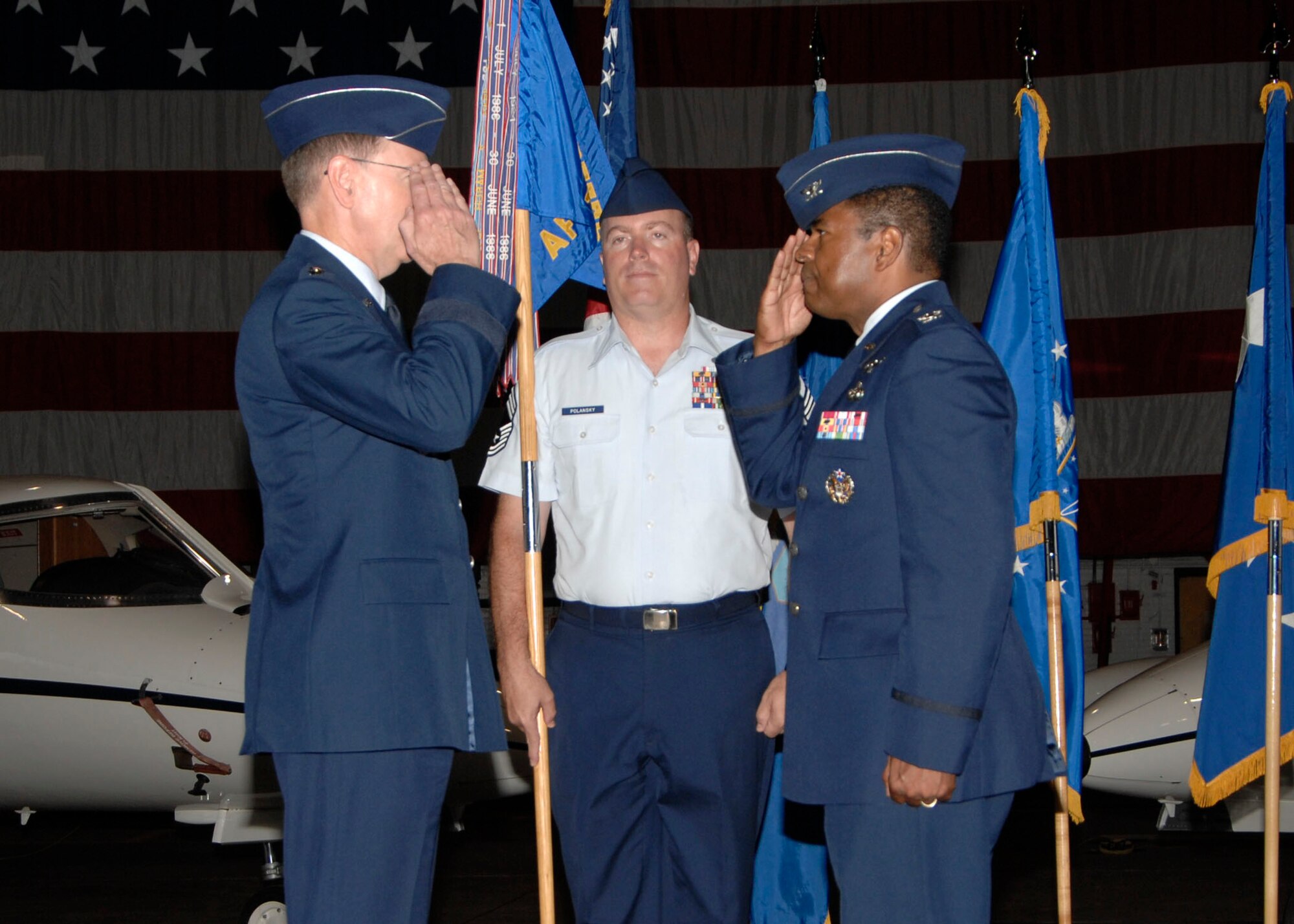 SCOTT AIR FORCE BASE, Ill. -- Col. Carl Williamson, former AFCA commander salutes, Gen. Robert Kehler, Air Force Space Command commander, as he relinquishes command of the AFCA July 15. (U.S. Air Force photo/ Airman 1st Class Tristin English) 
