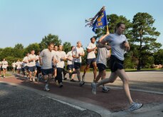 Airmen from the 437th Logistics Readiness Squadron stick together during the final leg of the Commander's 5K Run/Walk Challenge held here July 10. More than 450 people from around the base came out to participate in the monthly challenge. (U.S. Air Force photo/Staff Sgt. Daniel Bowles)