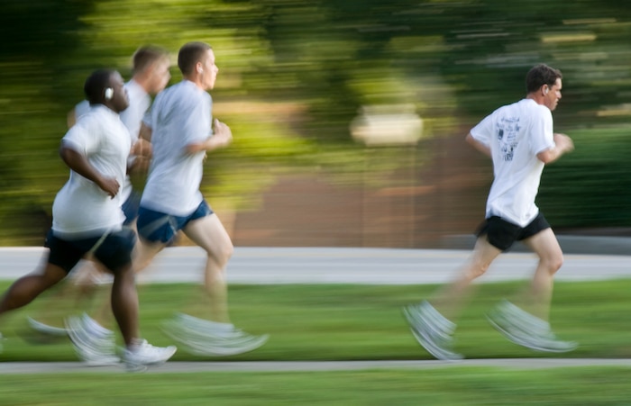 A group of runners speed ahead toward the finish line during the Commander's 5K Run/Walk Challenge here July 10. A base fitness challenge is normally held the first Friday of each month, promoting a fit-to-fight force at Charleston AFB. (U.S. Air Force photo/Laurie Ladd)