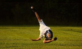 Jeremy Lock makes a diving catch during a softball game against the 437th Aerial Port Squadron here July 14. The 1st Combat Camera Squadron dominated the field as they played a double header against the 437 APS, where they won 10-7, and beat the 437th Force Support Squadron 10-2. Lock is a combat photographer with the 1 CTCS. (U.S. Air Force photo/Senior Airman Nicholas Pilch)